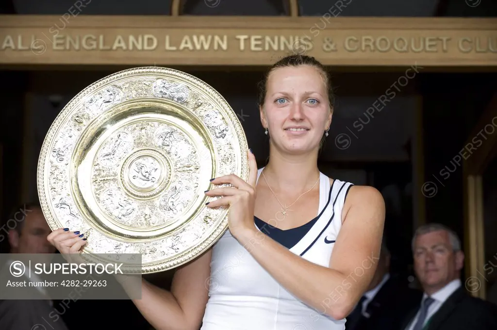 England, London, Wimbledon. Petra Kvitova (CZE) with the Venus Rosewater Dish on the front steps of the club house after victory in the Ladies' singles final at the 2011 Wimbledon Tennis Championships.