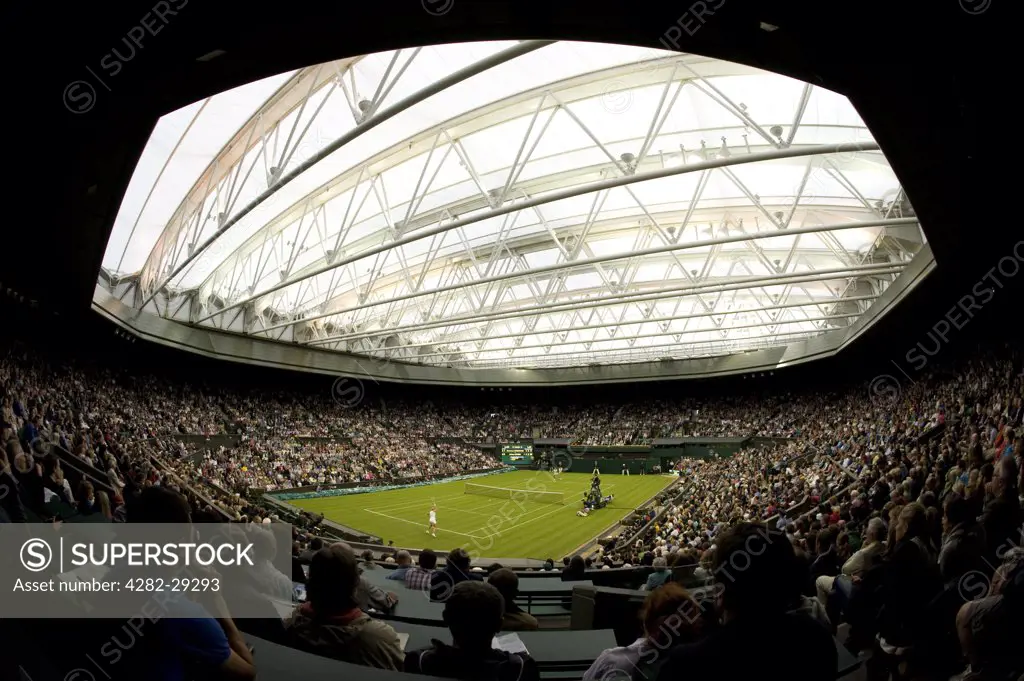 England, London, Wimbledon. A match between Francesca Schiavone and Jelena Dokic under the roof on Centre Court at the 2011 Wimbledon Tennis Championships.