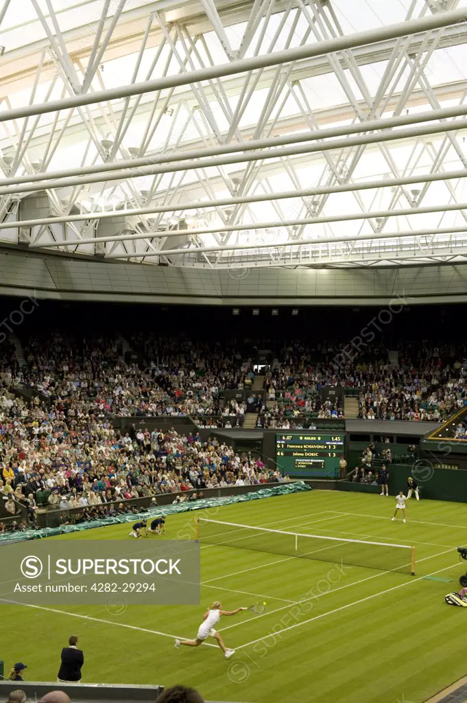 England, London, Wimbledon. A match between Francesca Schiavone and Jelena Dokic under the roof on Centre Court at the 2011 Wimbledon Tennis Championships.