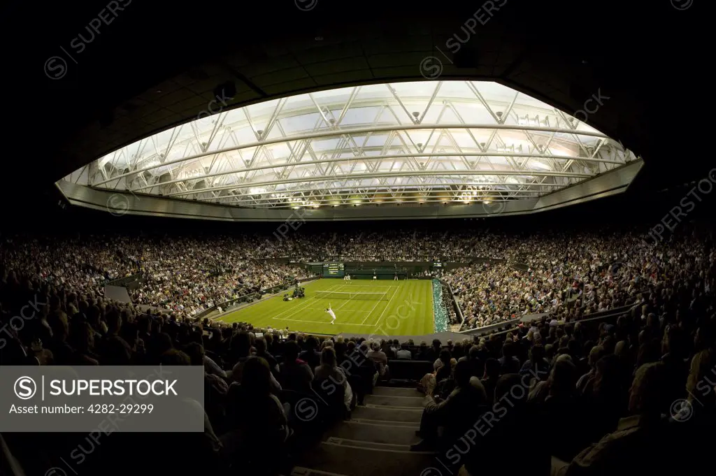 England, London, Wimbledon. Andy Murray in action against Daniel Gimeno-Traver on Centre Court under the roof at the 2011 Wimbledon Tennis Championships.