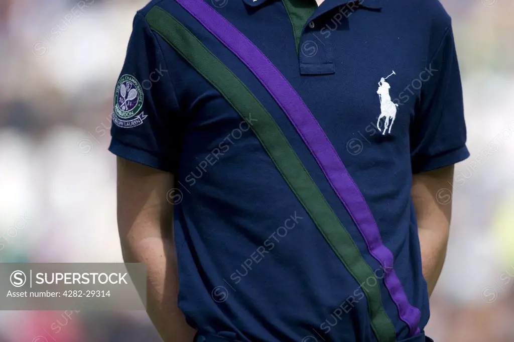 England, London, Wimbledon. Ball boy on match duty wearing a Polo Ralph Lauren shirt at the 2011 Wimbledon Tennis Championships.