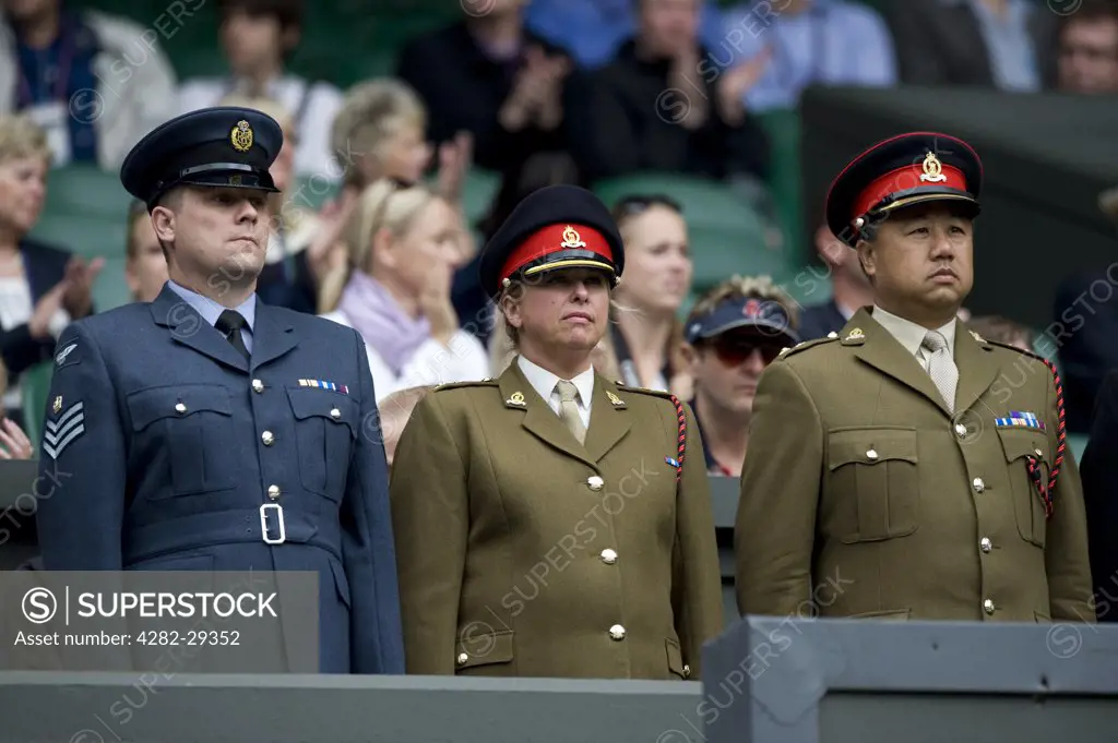 England, London, Wimbledon. Chief Service Stewards stand on Centre Court during Armed Services day during the 2011 Wimbledon Tennis Championships.