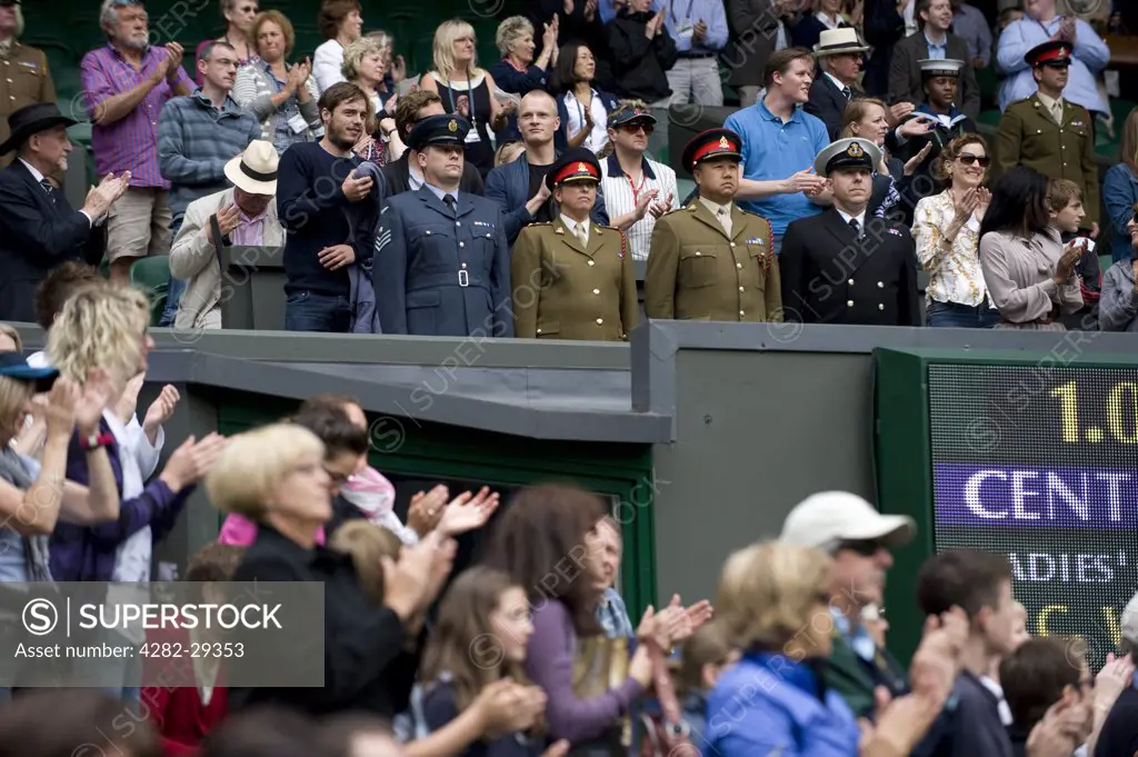 England, London, Wimbledon. Chief Service Stewards stand on Centre Court during Armed Services day during the 2011 Wimbledon Tennis Championships.