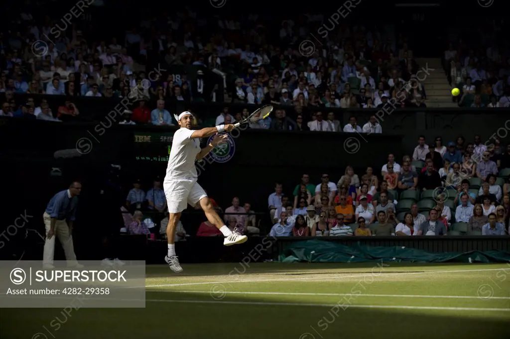 England, London, Wimbledon. Marcos Baghdatis (CYP) in action in a men's singles match at the 2011 Wimbledon Tennis Championships.