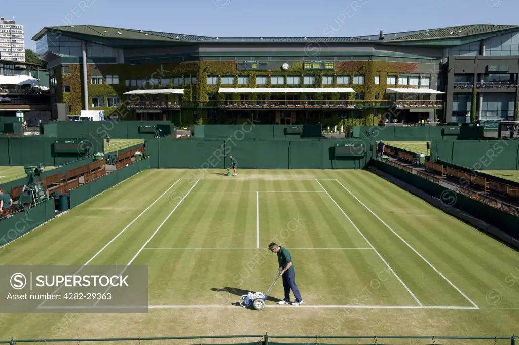 England, London, Wimbledon. Groundsmen preparing Court 10 for play at the 2011 Wimbledon Tennis Championships.