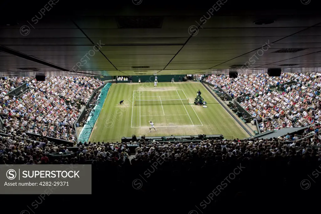 England, London, Wimbledon. Rafael Nadal and Novak Djokovic in action on Centre Court in the Mens singles final at the 2011 Wimbledon Tennis Championships.