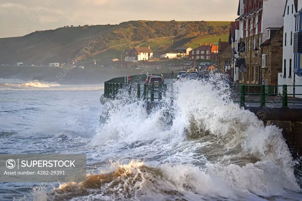 England, North Yorkshire, Sandsend. Large waves from the North Sea buffeting the seafront at Sandsend.