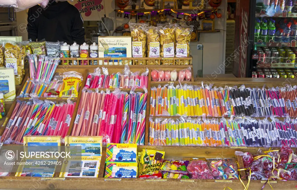 England, North Yorkshire, Whitby. Sticks of rock and sweets on display in a sweet shop in Whitby.