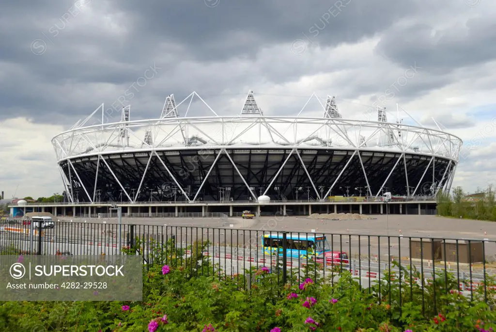 England, London, Stratford. Dramatic clouds over the 2012 Olympic Stadium.