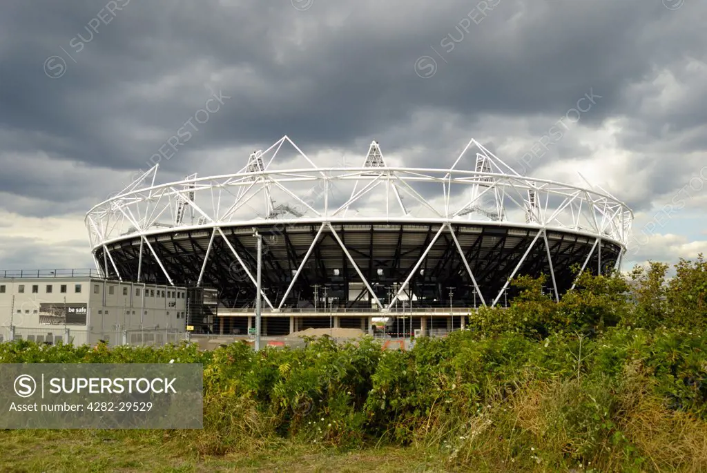 England, London, Stratford. Dark storm clouds over the 2012 Olympic Stadium.