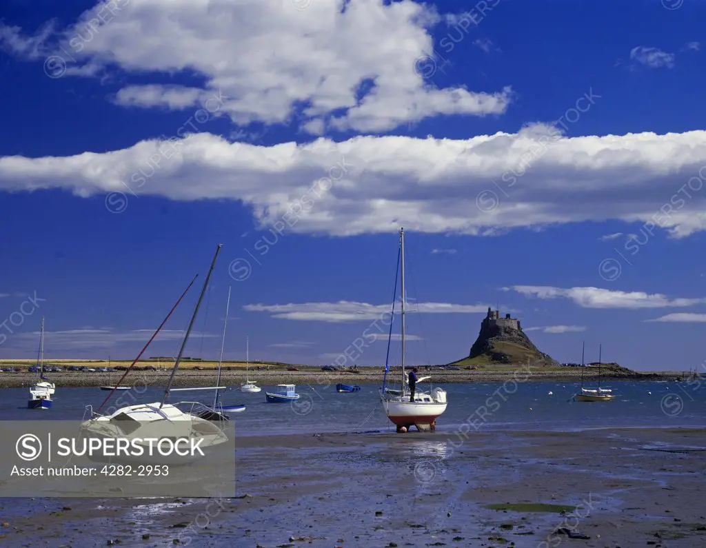England, Northumberland, Holy Island. A view to Lindisfarne Castle across the harbour.