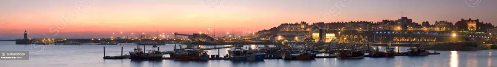 England, Kent, Ramsgate. A panoramic view of Ramsgate harbour and marina at dusk.