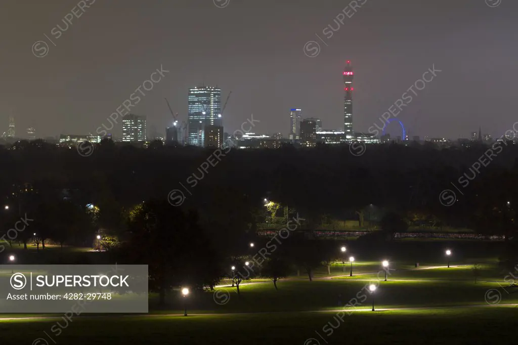 England, London, Primrose Hill. The London skyline at night from the top of Primrose Hill.