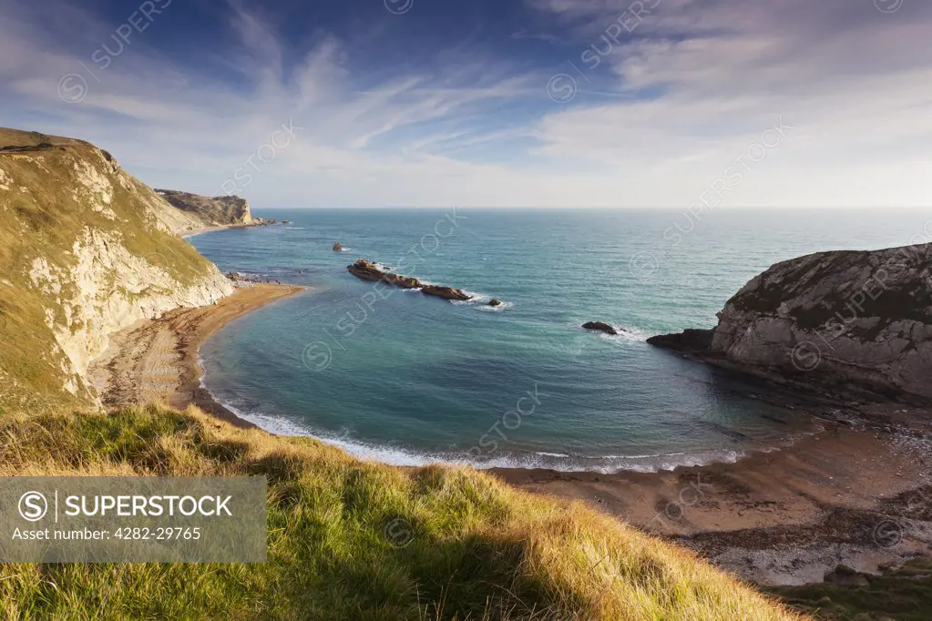 England, Dorset, Man O' War Bay. Man O' War Bay on the Jurassic Coast, part of St Oswald's Bay. The rocks in the sea are said to look like war ships.