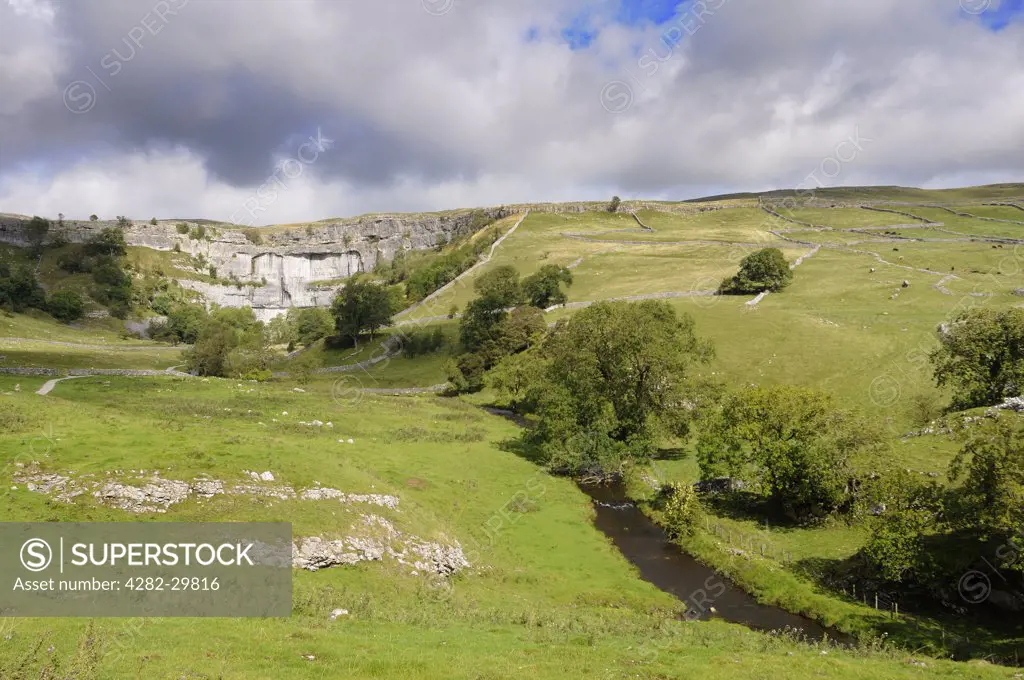 England, North Yorkshire, Malham Cove. Malham Cove, a spectacular curved limestone formation in the Yorkshire Dales National Park.
