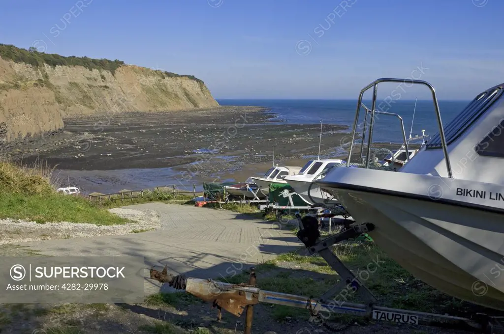 England, North Yorkshire, Robin Hoods Bay. Boats mounted on trailers by the slipway at Robin Hoods Bay.