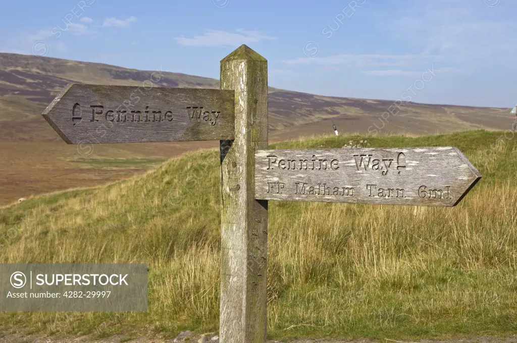 England, North Yorkshire, Yorkshire Dales. Pennine Way footpath sign near Pen Y Ghent showing direction and distance to Malham Tarn.