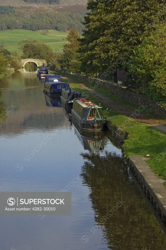 England, North Yorkshire, Gargrave. Narrow boats moored on the Leeds and Liverpool canal at Gargrave.