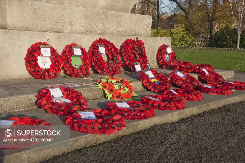 England, North Yorkshire, York. Poppy wreaths on the York City War Memorial in the Memorial Gardens.