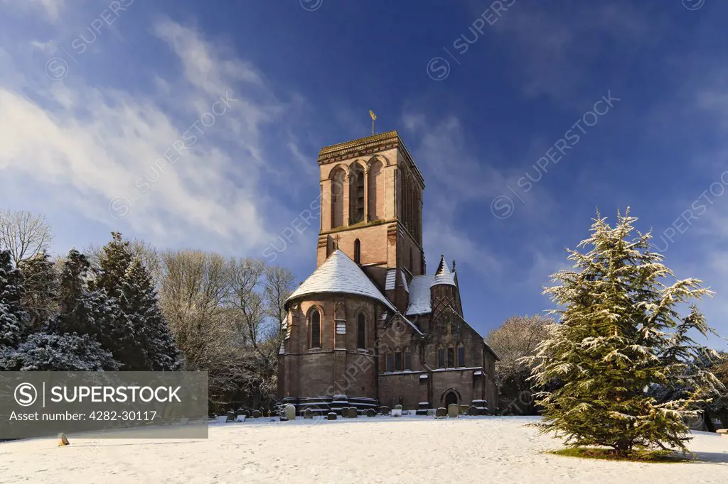 England, Dorset, Kingston. Snow covering the grounds of the Church of St. James at Kingston, on the Isle of Purbeck.