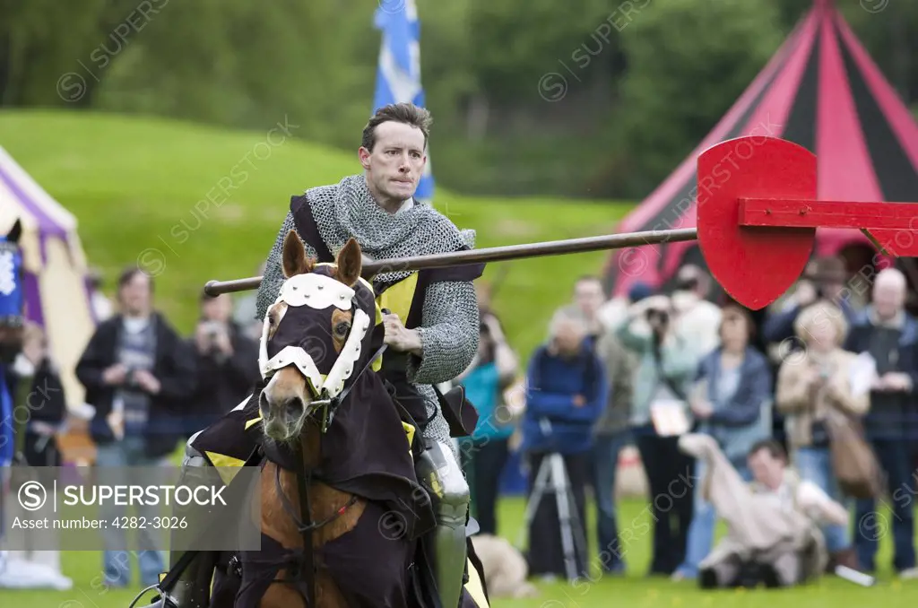 Scotland, West Lothian, Linlithgow. A knight on horseback in a jousting competition at a medieval pageant based around events at Scotland's royal court in 1503. Party at the Palace was held at Linlithgow Palace as a part of Homecoming Scotland 2009.