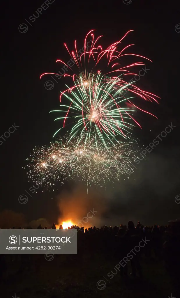 England, Somerset, Hatch Beauchamp. Crowds enjoying the annual bonfire night fireworks display at Hatch Beauchamp.