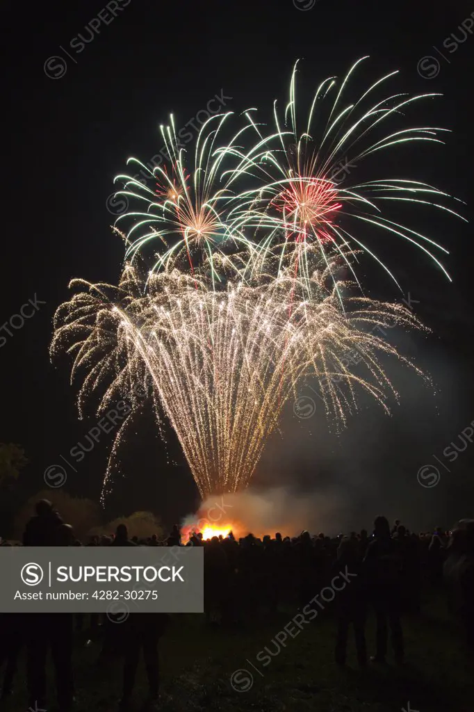England, Somerset, Hatch Beauchamp. Crowds enjoying the annual bonfire night fireworks display at Hatch Beauchamp.