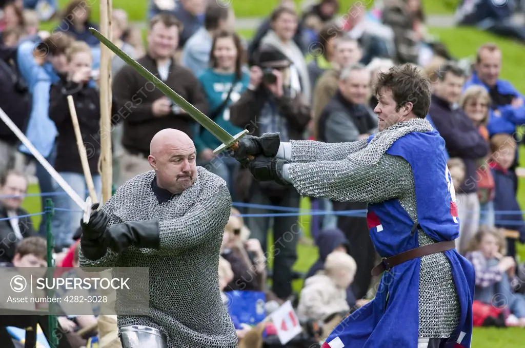 Scotland, West Lothian, Linlithgow. Warriors battle with swords at a medieval pageant based around events at Scotland's royal court in 1503. Party at the Palace was held at Linlithgow Palace as a part of Homecoming Scotland 2009.
