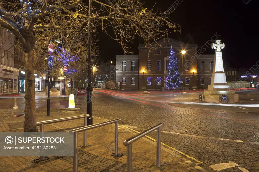 England, Somerset, Taunton. A large Christmas tree decorated with lights in front of the Market House in Taunton town centre.