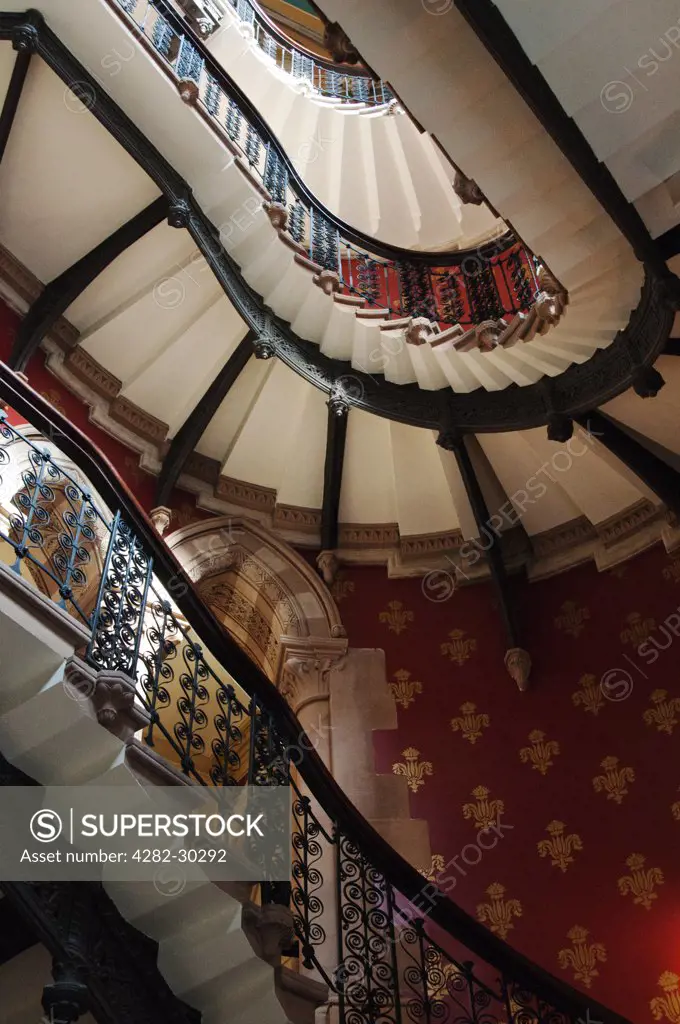 England, London, St Pancras. Grand staircase inside the St Pancras Renaissance Hotel. The staircase has been named Europe's Grandest Staircase.