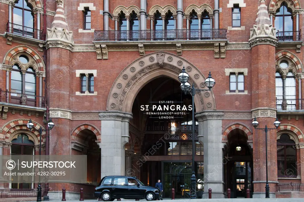 England, London, St Pancras. A black taxi cab waiting outside St Pancras Renaissance Hotel.