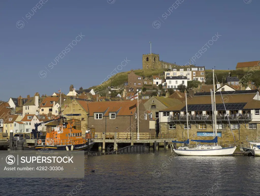England, North Yorkshire, Whitby. RNLI lifeboat George and Mary Webb moored below St Marys Church at Whitby Lifeboat Station.