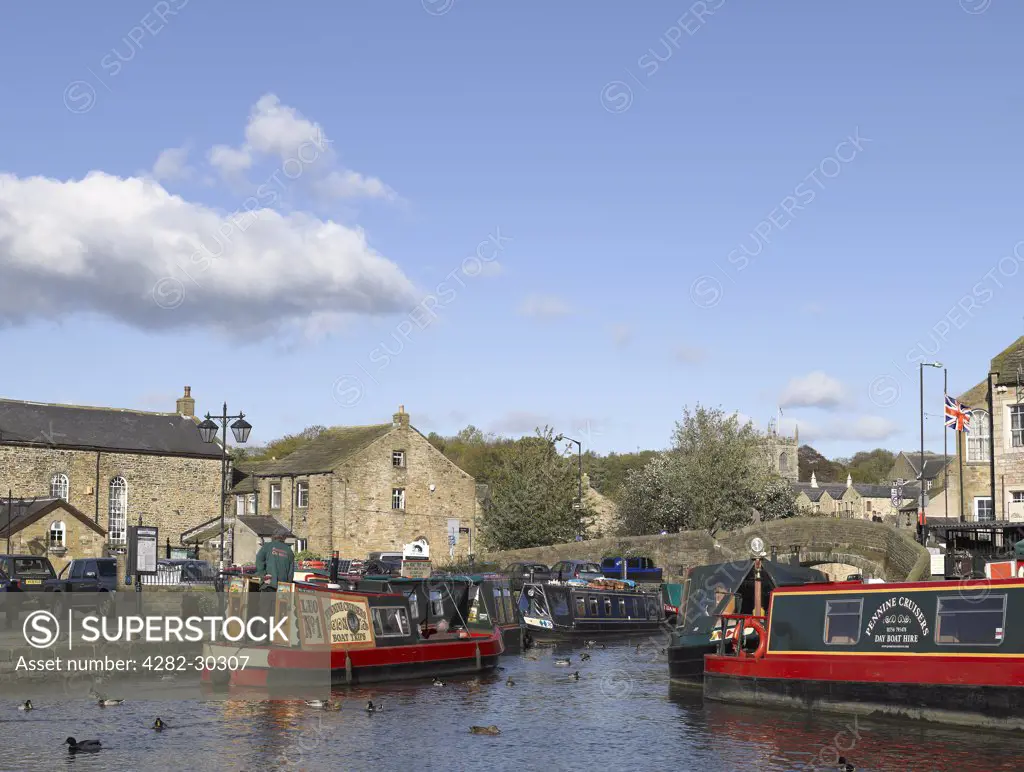 England, North Yorkshire, Skipton. Narrow boats for hire and boat trips on the Leeds and Liverpool canal.