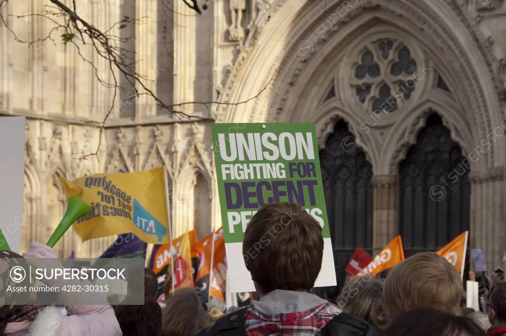 England, North Yorkshire, York. Members of UNISON trade union protesting for better pensions outside York Minster.