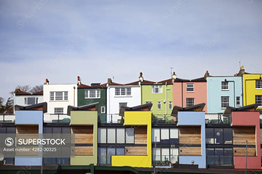 England, Bristol, Bristol. Colourful waterside flats in Pooles Wharf.
