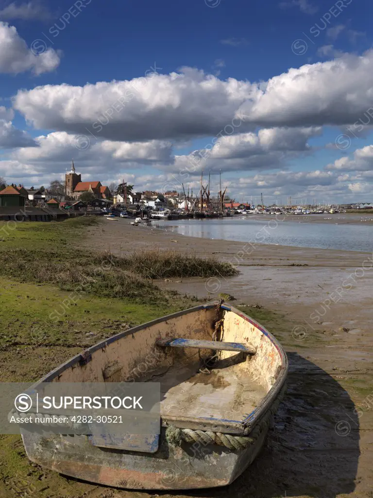 England, Essex, Maldon. A small rowing boat on the bank of the Blackwater Estuary at Maldon.