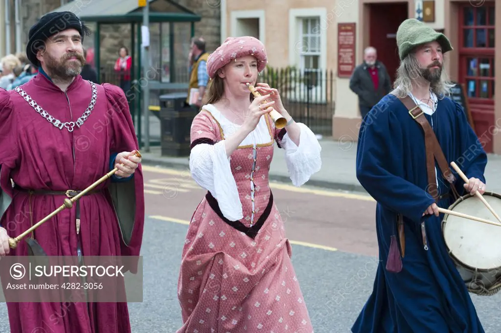 Scotland, West Lothian, Linlithgow. Costumed performers parading at a medieval re-enactment based around events at Scotland's royal court in 1503. Party at the Palace was held at Linlithgow Palace as a part of Homecoming Scotland 2009.