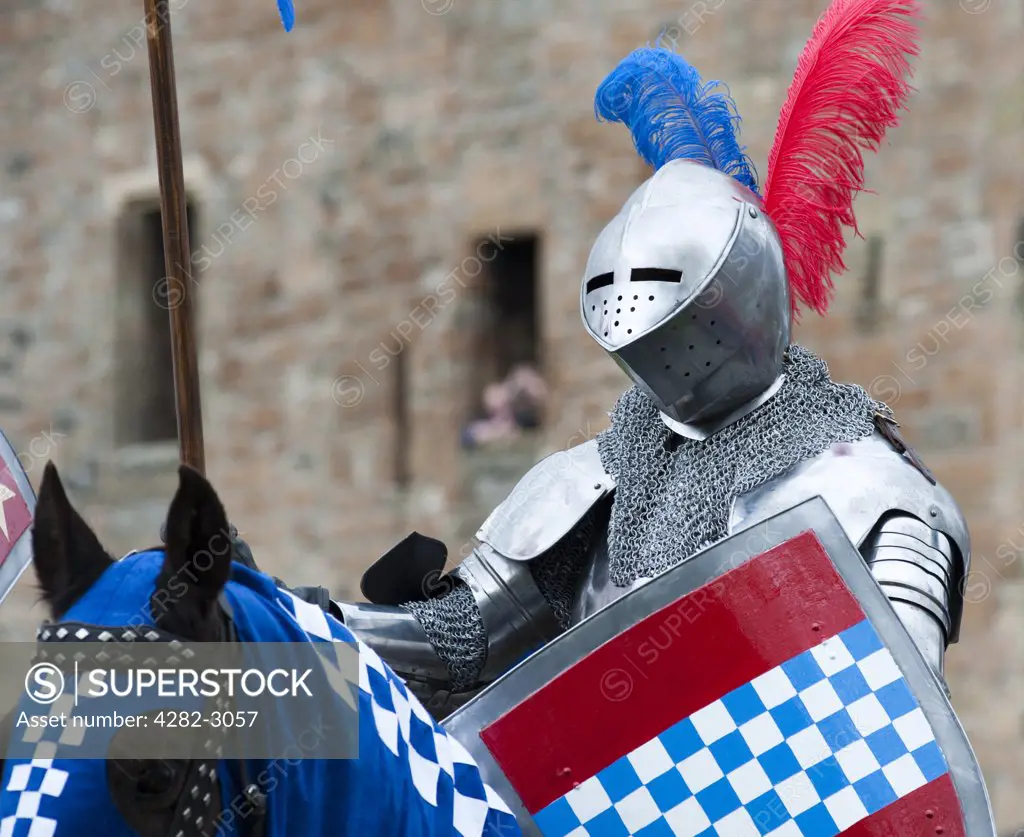 Scotland, West Lothian, Linlithgow. An armoured knight on horseback at a medieval re-enactment based around events at Scotland's royal court in 1503. Party at the Palace was held at Linlithgow Palace as a part of Homecoming Scotland 2009.