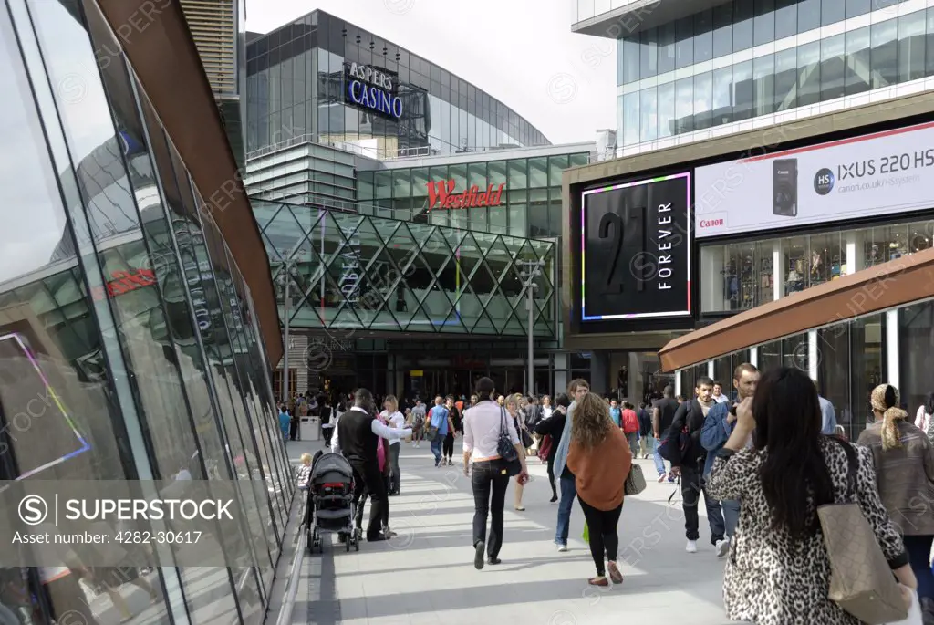 England, London, Stratford. People shopping at Westfield Stratford City shopping centre. The centre opened in 2011 and is the 3rd largest shopping centre in the UK.