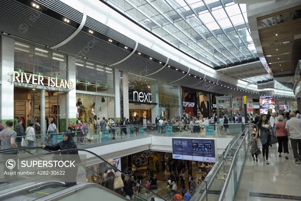 England, London, Stratford. People shopping in Westfield Stratford City shopping centre. The centre opened in 2011 and is the 3rd largest shopping centre in the UK.