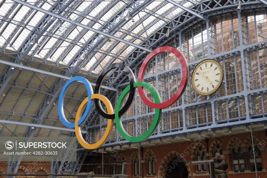 England, London, St Pancras. A giant set of Olympic rings hanging in St Pancras International Station.