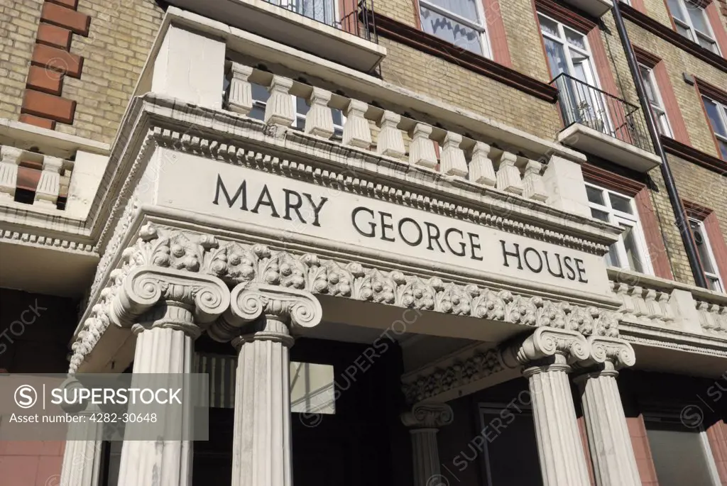 England, London, Knightsbridge. A portico at the entrance of Mary George House in Cromwell Road.