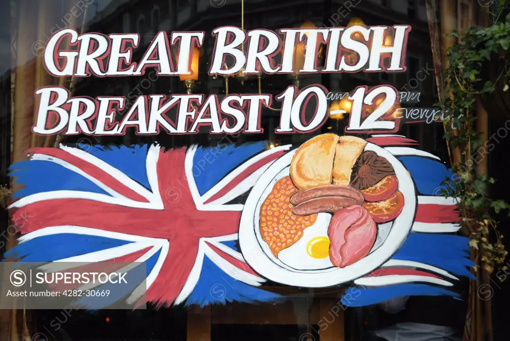 England, London, Covent Garden. Sign in the window of a London pub advertising its offer of a Great British Breakfast between 10 and 12.