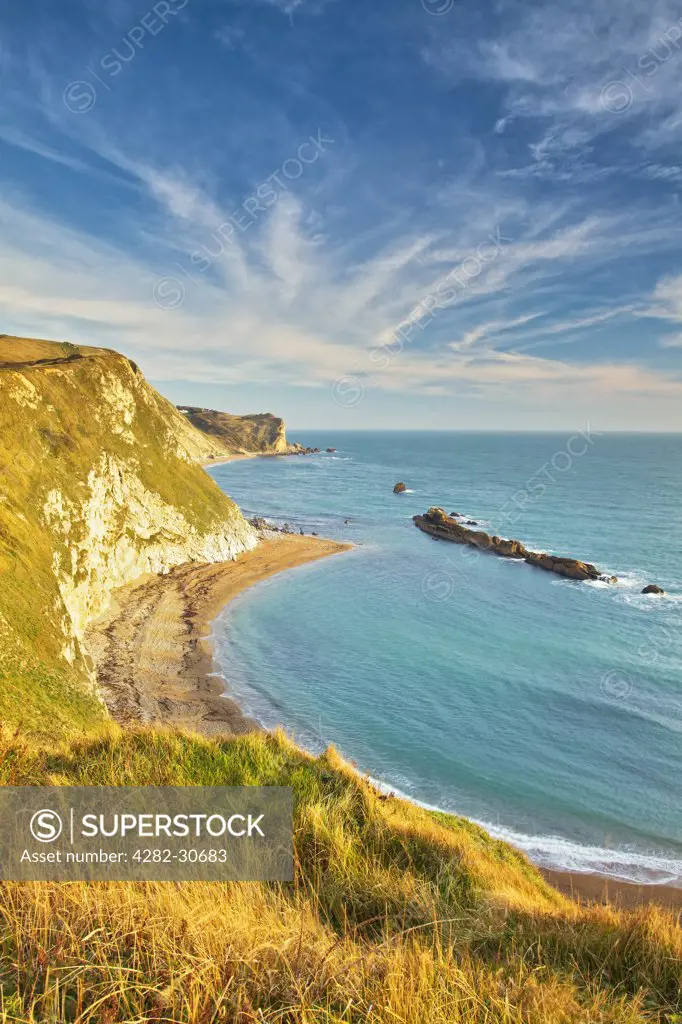 England, Dorset, Lulworth. View from the chalk cliffs above Man O'War Cove of St Oswald's bay on the Jurassic Coast.