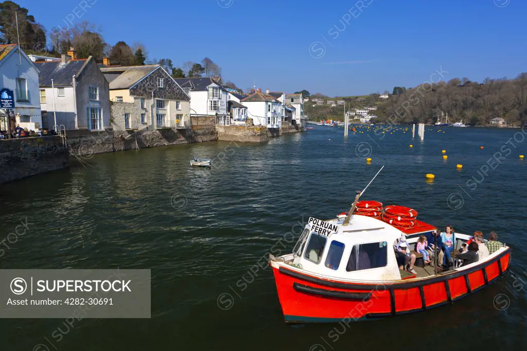England, Cornwall, Fowey. The Polruan Ferry, a passenger ferry that runs between the town of Fowey and village of Polruan at the mouth of the River Fowey.