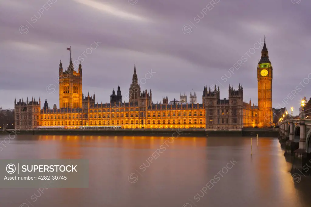 England, London, Westminster. Big Ben and the Houses of Parliament on the North bank of the River Thames.