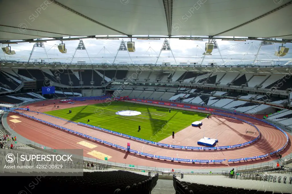 England, London, Stratford . An interior view of the Olympic stadium looking down onto the running track.