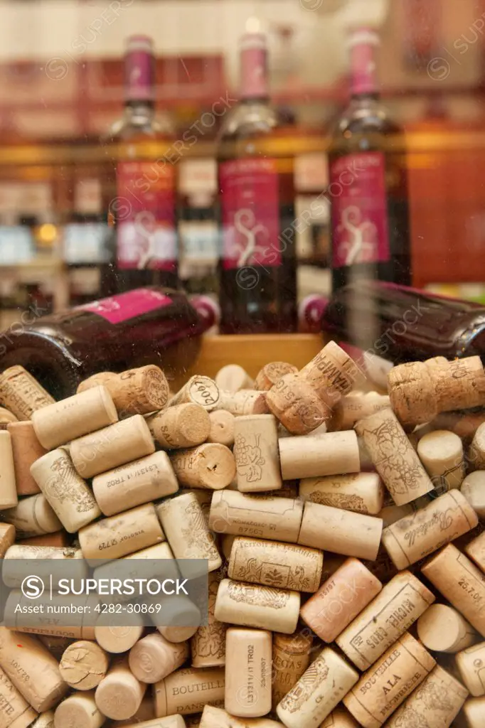 England, London, City of London. Wine corks on display in a shop window in Leadenhall Market.