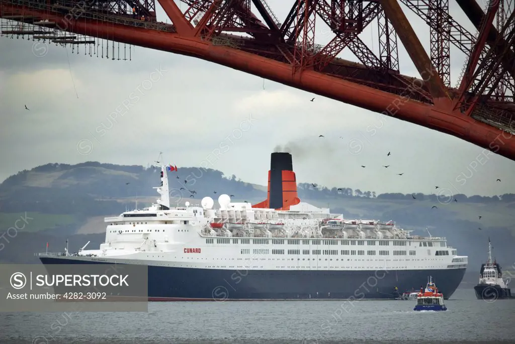 Scotland, City of Edinburgh, South Queensferry. The QE2 (Queen Elizabeth 2) at anchor in the River Forth at South Queensferry during her farewell tour in September 2007.