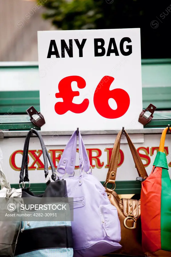 England, London, Oxford Street. Handbags for sale from a street stand on Oxford Street.